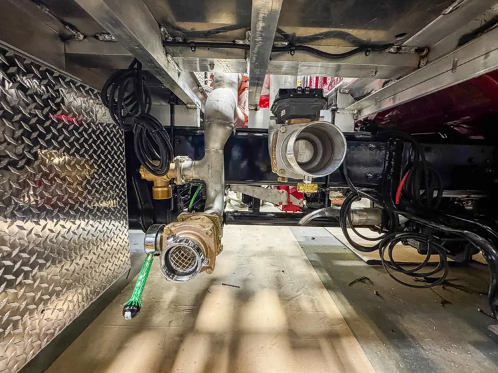 Pump and plumbing components during installation, photo 103 of 303.